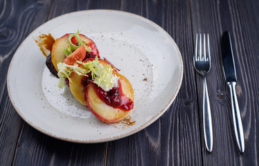Goose liver with cherry sauce and apples