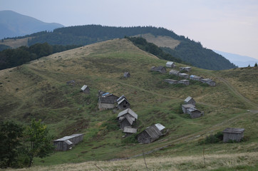 Fototapeta na wymiar Wooden shepherds' houses in the Ukrainian Carpathians.