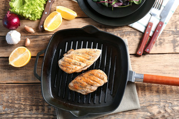 Delicious chicken breasts in grill pan