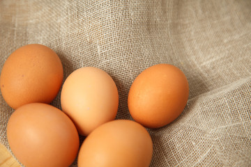eggs on the tableChicken eggs on burlap vintage background