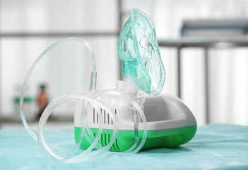 Compressor nebulizer with mask on table