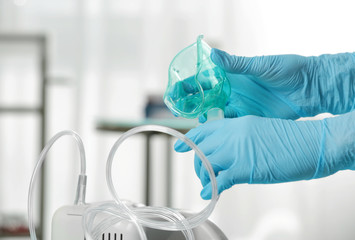 Doctor preparing compressor nebulizer for use