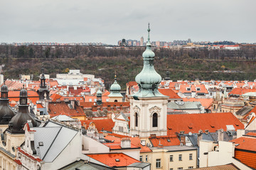 Naklejka na ściany i meble Aerial view on the red roofs of old European town Prague