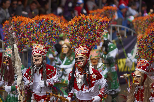 Tobas dancers in colourful costumes performing at the annual Oruro Carnival. The event is designated by UNESCO as being Intangible Cultural Heritage of Humanity.
