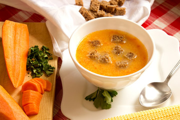 Pea cream soup with carrots, pumpkins and rye croutons