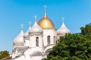 Fototapeta na wymiar Domes of Saint Sophia cathedral against the blue sky in Great Novgorod, Russia