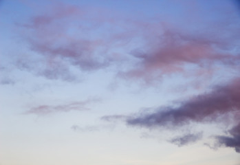 Gray rare clouds on blue sky