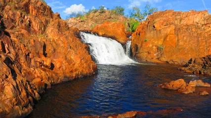 Tuinposter Beautiful Edith Falls waterfall with red rocks in the Northern Territory NT, Australia near Pine Creek © Sergiy