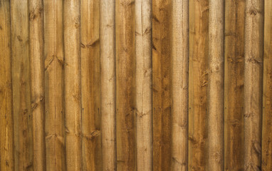 Tightly knocked down vertical boards with wood background