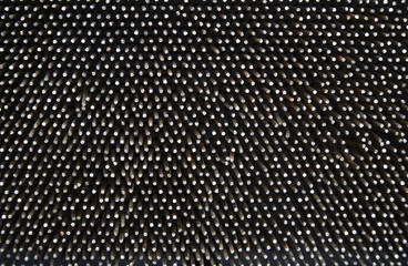 Dark worn rusty metal nails texture background.