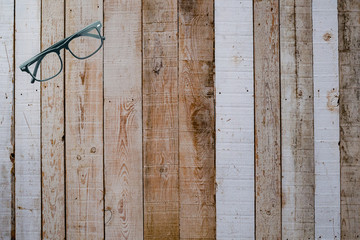  Eyeglasses Glasses with Black Frame Fashion Vintage Style on Wood Desk Background, .Top view with copy space.selective focus