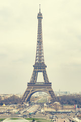 The Eiffel tower is one of the most recognizable landmarks in the world under sun light,selective focus,vintage color