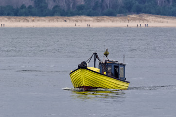 FISHING BOAT - Yellow boat on the Pomeranian bay © Wojciech Wrzesień