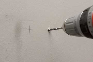 drilling hole in a wall