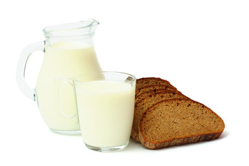 Glass jug pitcher of fresh milk with glass and black bread isolated on white background carafe