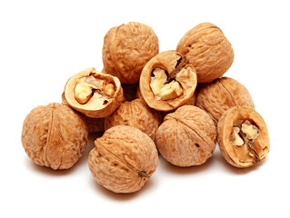 Dry walnuts in shell isolated on white background. Flat lay, top view