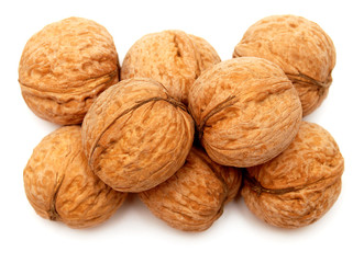 Dry walnuts in shell isolated on white background. Flat lay, top view