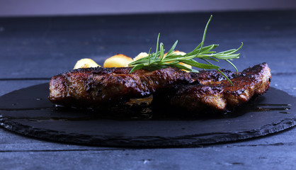 Grilled steaks, baked dumplings potatoes