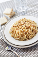 Fried cabbage with caraway and garlic on a plate
