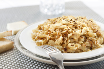 Fried cabbage with caraway and garlic on a plate