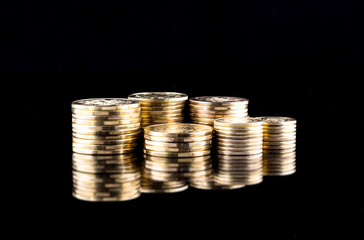 Gold money coin stacking on dark background