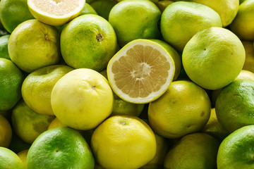 Exotic fruits - sweetie, sweety, pomelo on the farmers market. Products rich in vitamins. Natural local products on the farm market. Harvest. Food.