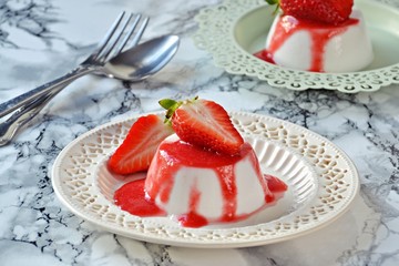 Healthy Vegetarian Coconut Panna Cotta with strawberry sauce 
