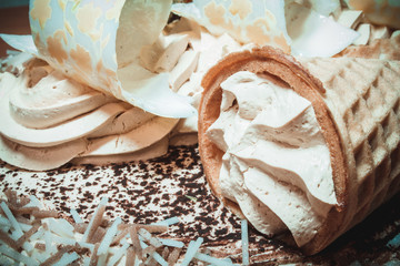 A delicious chocolate mousse cake decorated with a waffle cone and a glaze is an excellent dessert...