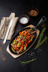 Steamed vegetables with beef and sesame seeds