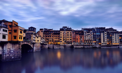 Obraz premium Ponte Vecchio bridge over the river Arno. Bridge was opened in 1345 and is one of the biggest tourist attractions in Florence. Italy