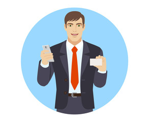 Businessman with mobile phone shows the business card
