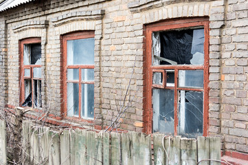 Old abandoned house with broken windows
