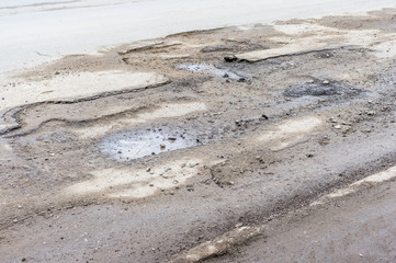 Fototapeta na wymiar Destroyed road surface