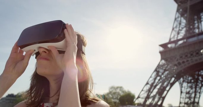 Tourist woman Eiffel tower Paris wearing virtual reality headset  watching 360 video imagination concept