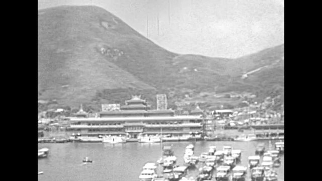 Aberdeen Fishing Village in Hong Kong, a picturesque Harbour with seafood markets, Sampan boat tours and floating restaurants. Historic restored footage on 1980.