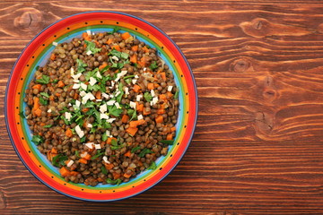 Lentil with carrot and onion in bowl