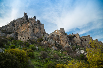 Fototapeta na wymiar The Saint Hilarion Castle lies on the Kyrenia mountain range, in Cyprus. This location provided the castle with command of the pass road from Kyrenia to Nicosia. Beautiful Castle in the Mountains.
