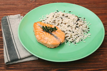 Salmon with wild rice on a plate