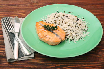 Salmon with wild rice on a plate
