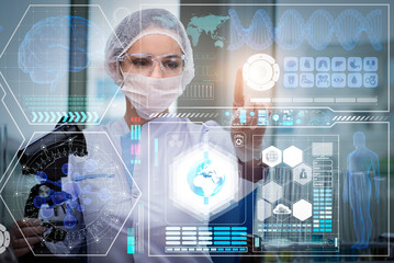 Doctor in futuristic medical concept pressing button