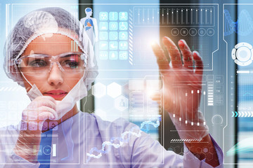 Doctor in futuristic medical concept pressing button