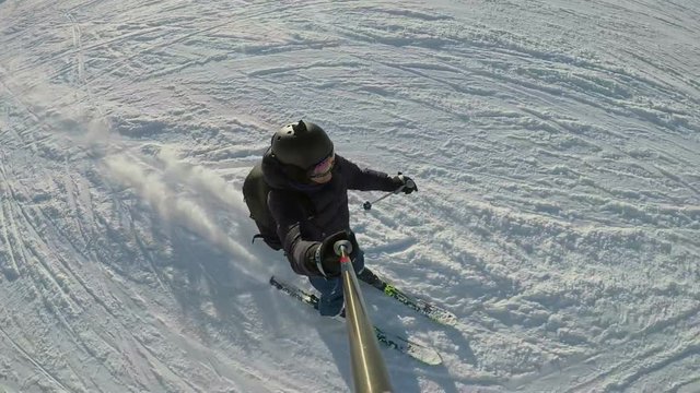 Overhead POV shot of skier on ski run, slow motion