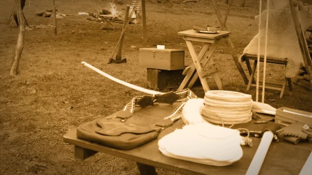 Native american indian tribe environment near the edge of a forest - Sepia Version