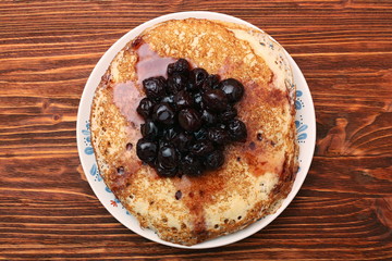 Delicious pancakes with cherry jam