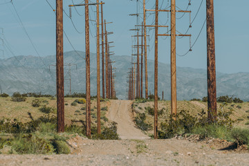 Old power grid dirt road,  wooden electric poles