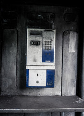 old public telephone machine left with grunge photography style effect photo taken in Jakarta Indonesia
