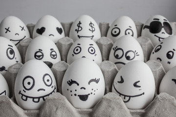Eggs with faces photo for your design. in the box