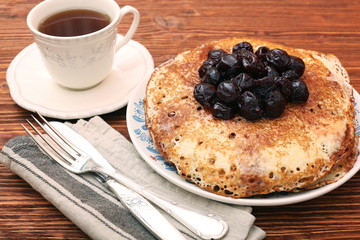 Delicious pancakes with cherry jam