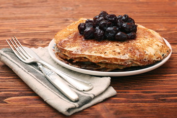 Delicious pancakes with cherry jam