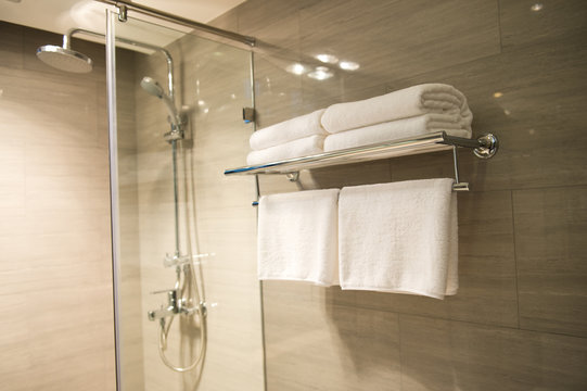 Clean white towel on a hanger prepared to use.